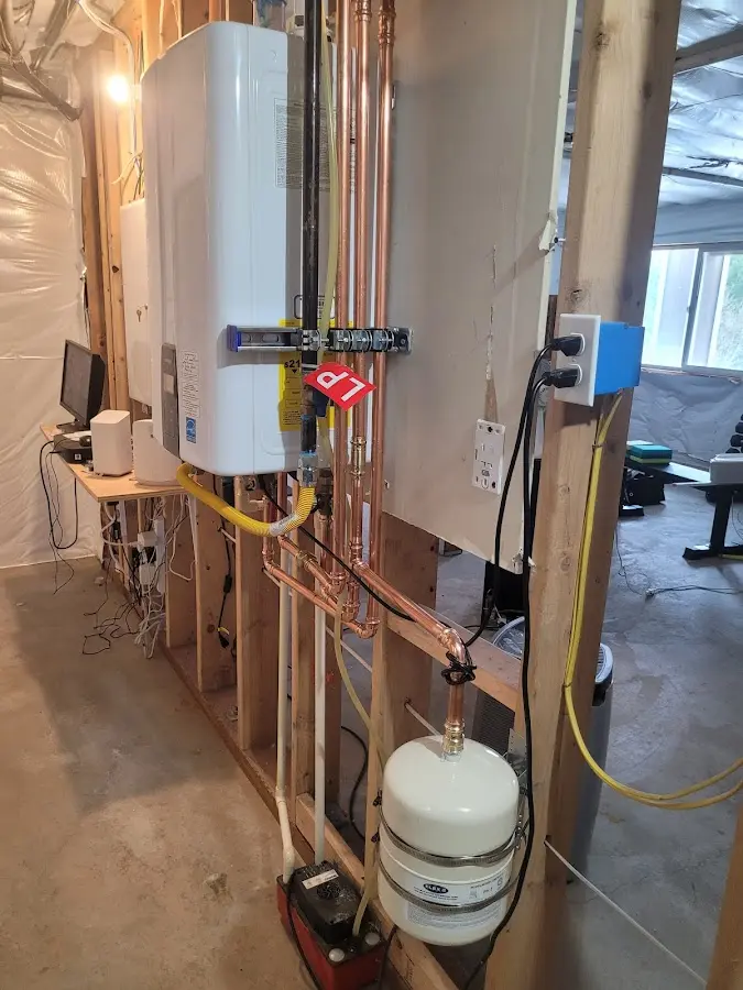 Licensed plumber repairing a kitchen sink in Bloomfield